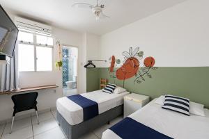 Un pat sau paturi într-o cameră la Hotel Prainha