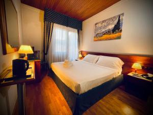 Postel nebo postele na pokoji v ubytování Hotel Hermitage