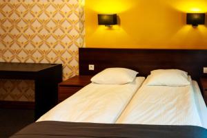 Posteľ alebo postele v izbe v ubytovaní Apartamenty Przy Plaży