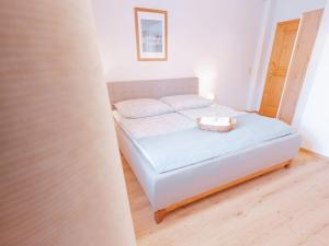 Postel nebo postele na pokoji v ubytování Apartment Haus Toplitzsee nahe dem Grundlsee und Toplitzsee