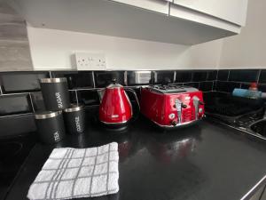 a kitchen counter with two toasters and a toaster at Blackpool Abode - 124 Elite Apartments in Blackpool