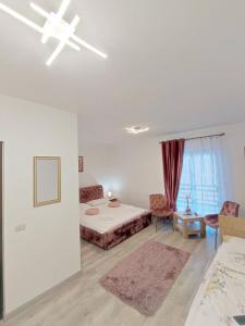 a white room with a bed and a window at Vila CASA HATERE in Moisei +26 photos