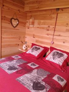 a bedroom with two beds in a wooden room at Au Paradou du Bûcheron Adults only in Lessive +43 photos