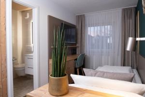 Postel nebo postele na pokoji v ubytování Gasthaus Hotel Kranz