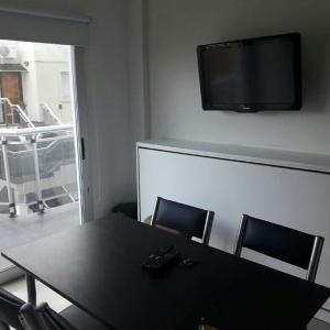 Et tv og/eller underholdning på Depto frente al mar San Bernardo