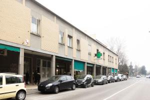 a row of cars parked in front of a building at Andreini, Bologna by Short Holidays in Bologna