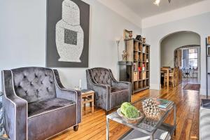 a living room with two chairs and a table at Contemporary Jersey City Abode about 5 Mi to NYC! in Jersey City