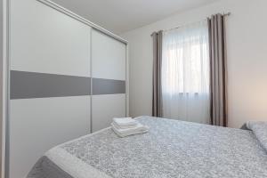 Łóżko lub łóżka w pokoju w obiekcie Koraca B4