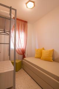 a bedroom with two bunk beds and a window at Maison Sophie in Chioggia