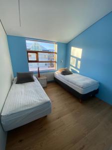 Postel nebo postele na pokoji v ubytování Reykjavík Central Apartments