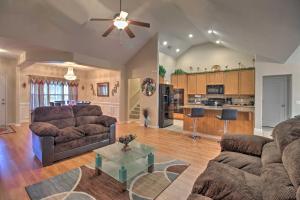 a living room with two couches and a table at Rincon Home with Game Room, 18 Mi to Savannah! in Rincon