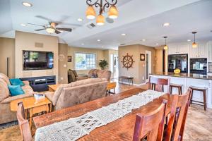 a living room with a dining table and a kitchen at Deluxe Laguna Hills Home with Outdoor Oasis! in Laguna Hills