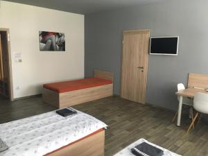 Postel nebo postele na pokoji v ubytování Penzion Relax Litovel