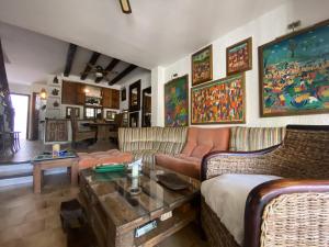 a living room with couches and a coffee table at R97 Casa Alorda in Calafell