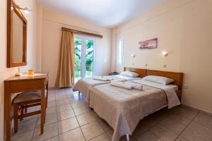 Postel nebo postele na pokoji v ubytování Anesis Residence