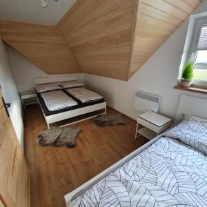 an overhead view of a bedroom with two beds at Apartament Grel in Nowy Targ