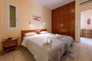 Postel nebo postele na pokoji v ubytování Anesis Residence
