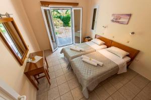 Postel nebo postele na pokoji v ubytování Anesis Residence