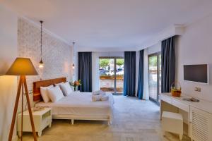 Postel nebo postele na pokoji v ubytování Arnna Hotel