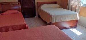 Voodi või voodid majutusasutuse Canal Inn Panama toas