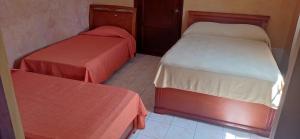 Voodi või voodid majutusasutuse Canal Inn Panama toas