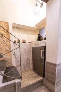 a kitchen with a counter and a dishwasher at Caveau in Palermo