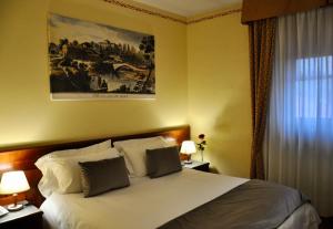 Postel nebo postele na pokoji v ubytování Hotel Hermitage