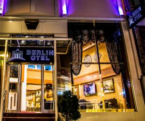 a sign in the window of a restaurant at Berlin Hotel Nisantasi in Istanbul
