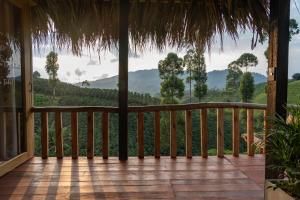 a porch with a view of the mountains at Eco Hotel Glamping El Silencio in Santa Rosa de Cabal