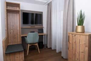 TV a/nebo společenská místnost v ubytování Gasthaus Hotel Kranz