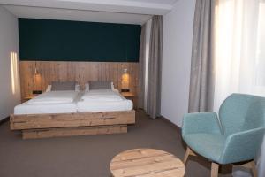 Postel nebo postele na pokoji v ubytování Gasthaus Hotel Kranz