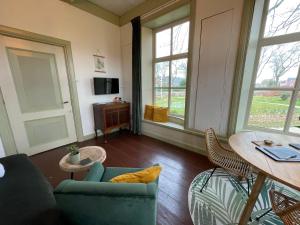Fotografie z fotogalerie ubytování Suite in prachtige Groningse boerderij uit 1856 v destinaci Schildwolde