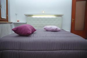 Posteľ alebo postele v izbe v ubytovaní B&B Nonna BI