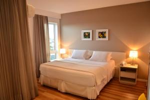 Postel nebo postele na pokoji v ubytování Unico Apart Hotel