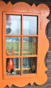 a window with a vase sitting inside of it at Vila Líška in Pavčina Lehota