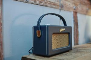 a small radio sitting on top of a table at Kings Arms in Egham