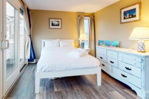 Postel nebo postele na pokoji v ubytování Cape Shell Oasis