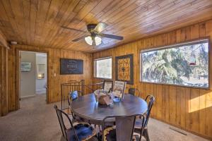 a dining room with a table and a ceiling fan at Cozy CO Rocky Mountain Retreat Near Pikes Peak! in Green Mountain Falls