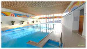 a large swimming pool in a building at Apartment THE VIEW in Zirkitz