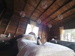 Postel nebo postele na pokoji v ubytování Cabaña Sueños Dorados