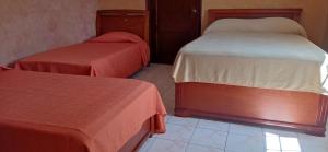 Voodi või voodid majutusasutuse Canal Inn Panama toas