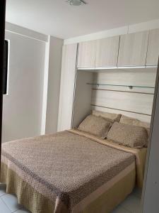 a bedroom with a bed in a room at Apartamento Manaíra pertinho do Mar in João Pessoa