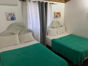 Postel nebo postele na pokoji v ubytování Apartamentos Magallanes Bayahibe