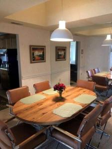 a dining room with a wooden table and chairs at Sugar Top 2403 condo in Sugar Mountain