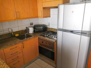 Dapur atau dapur kecil di Departamento Viña del Mar Coraceros