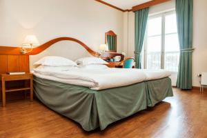 Postel nebo postele na pokoji v ubytování Hotel Bishops Arms Malmö