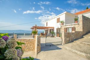 a villa with a view of the ocean at Apartment Peace and quiet in Jelsa