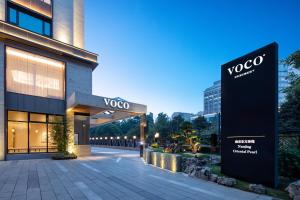 a sign in front of a building at voco Nanjing Oriental Pearl in Nanjing