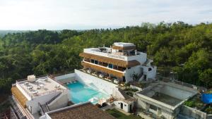 an aerial view of a house with a swimming pool at Bohol Coastal View Hotel in Taiwala