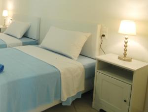 מיטה או מיטות בחדר ב-Lino Apartments